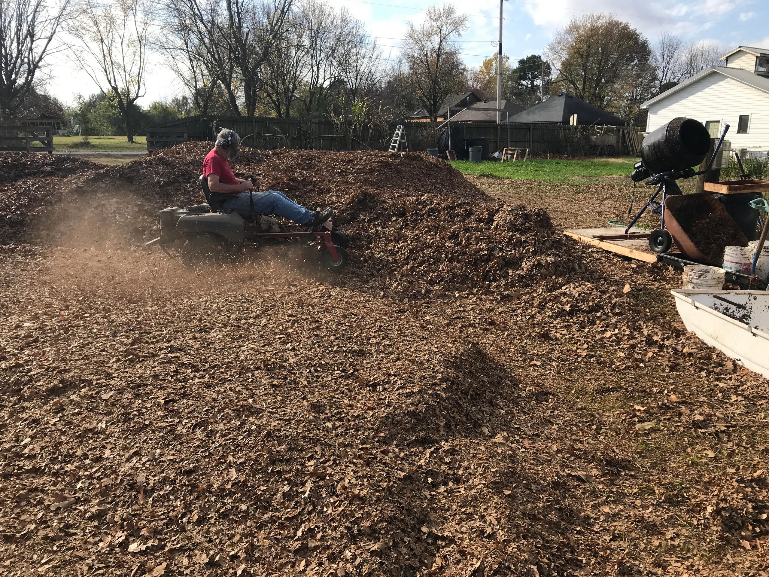 Chopping leaves for the compost bins